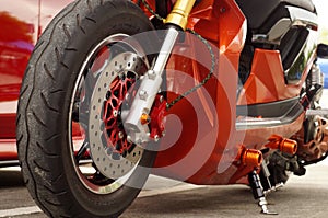 Close up of big motorcycle front wheel, focus tyre