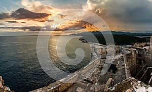 San Pedro de La Roca fort walls with canon, Carribean sea sunset