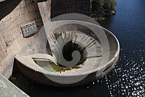 San Roque dam water funnel in Villa Carlos Paz, Cordoba, Argentina photo