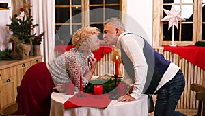 San Valentines’ day. Pensioners enjoying surprise together. In love people kissing.