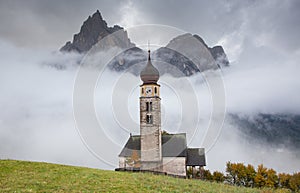 san Valentino church on a foggy late autumn day, Siusi allo Sciliar, Castelrotto, Dolomites, Italy