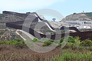 San Ysidro, CA, USA - July 30, 2023: The USA Mexico Border Wall near Border Field State Park Beach