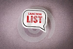 SANCTION LIST. Speech bubble with text on gray background photo