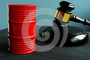 Sanction and regulation. Barrel of oil and gavel photo