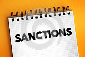 Sanctions - commercial and financial penalties applied by states or institutions against states or individuals, text concept on
