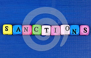 Sanctions word on a wood table