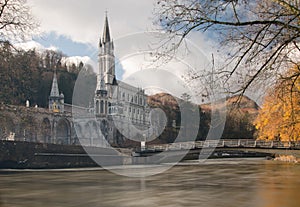 Sanctuaries of Lourdes from Gave de Pau River photo