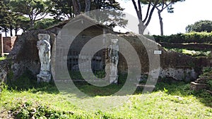 Sanctuary of Attis with its graven statues surrounded by ruins and natural bush