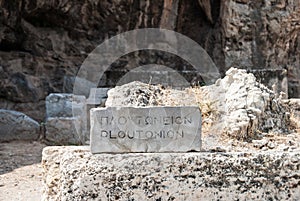 Stone inscription of Ploutonio in front of the sanctuary of Pluto Hades, god of the Underworld in Elefsina Greece photo