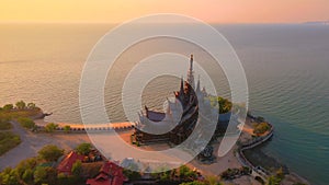 Sanctuary of Truth, Pattaya, Thailand, wooden temple by the ocean during sunset on the beach