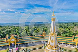 sanctuary at Wat Phra Maha Chedi Chai Mongkol ,Roi Et province, Thailand with the beautiful sky and cloud.The public properties.