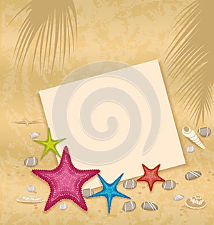 Sand background with paper card, starfishes, pebbl