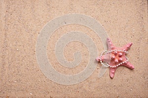 Sand Background with Pink starfish and pearls