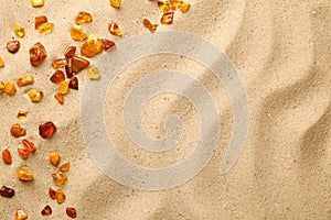 Sand Background With Scattered Ambers
