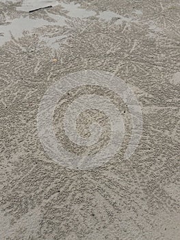 Sand balls created by crabs on secluded beach on Koh Chang island in Thailand