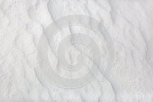 Sand on the the beach as background. Exotic tropical closeup of white sand pattern, beach template