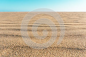 Sand on the beach for background. Brown beach sand texture and background. Summer and holiday concept