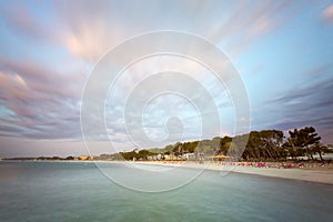 Sand beach deck chairs and pontoon