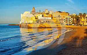 Sand beach and historical Old Town in mediterranean resort Sitges, Spain