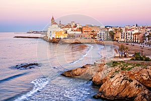 Sand beach and historical Old Town in mediterranean resort Sitges, Spain