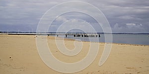 Sand beach in low tide in arcachon bay pontoon Pier of Andernos les Bains France