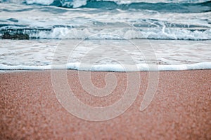 Sand beach near Barcelona background concept photo. Photography with waves and sea foam. Mediterranean winter sea