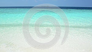 Sand beach and ocean wave, South Male Atoll. Maldives