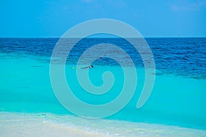 Sand beach and ocean wave, South Male Atoll. Maldives