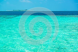 Sand beach and ocean wave, South Male Atoll. Maldives