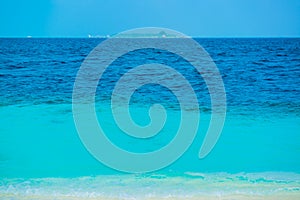 Sand beach and ocean wave, South Male Atoll. Maldives