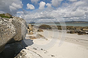 Sand beach with rocks photo