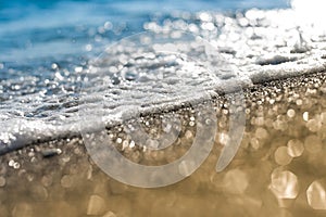 Sand beach and sea foam macro