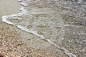 Sand Beach And Sea Foam Macro With Narrow Focus Background.