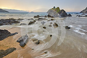 Sand beach at sunset in Basque Country. Laga beach. Spain photo