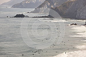 Sand beach with surfers viewed from above. Basque country, Spain