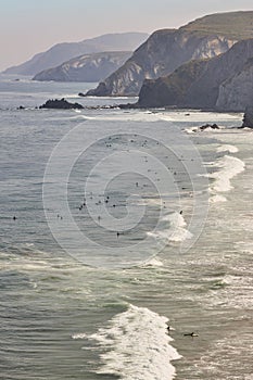 Sand beach with surfers viewed from above. Basque country, Spain