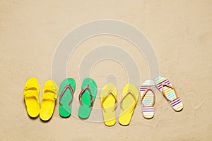 Sand beach texture background. Mockup summer vacation copy space. Set colorful flip flops. Blank template holiday funtime. Top