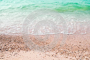 Sand beach with white sea soft wave on top view