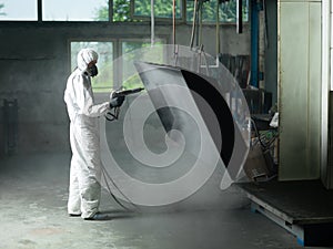 Sand blasting a metal