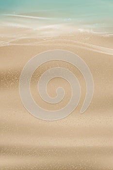 Sand with Blue ocean with soft wave form Background.Horizon Sand Beach Texture Waves for Summer Vacation on Seaside.Tropical