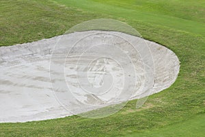 Sand bunker at the beautiful golf course.