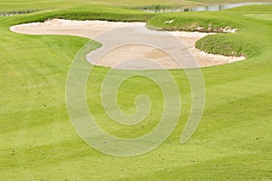 Sand bunker in beautiful golf course