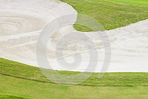Sand bunker at the beautiful golf course.