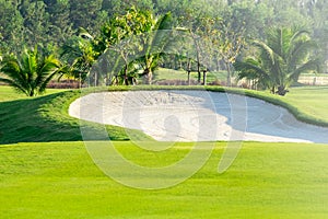 sand bunkers and lake in the golf course northern of Thailand with sky background