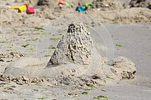 Sand castle as a symbol of illusion and fragility