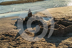Sand castle on the beach, summer sunny day