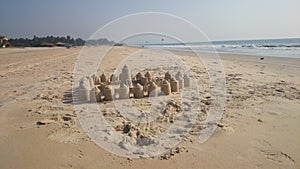 A sand castle built on the beach. North India, Colva