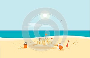 Sand Castle on Sandy Beach with Blue Sea Ocean and Clear Summer Sunny Sky