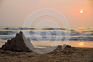 Sand castle at sunrise photo
