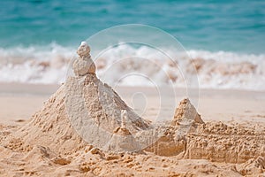 sand castles on the beach as symbol of a holiday with children at the sea